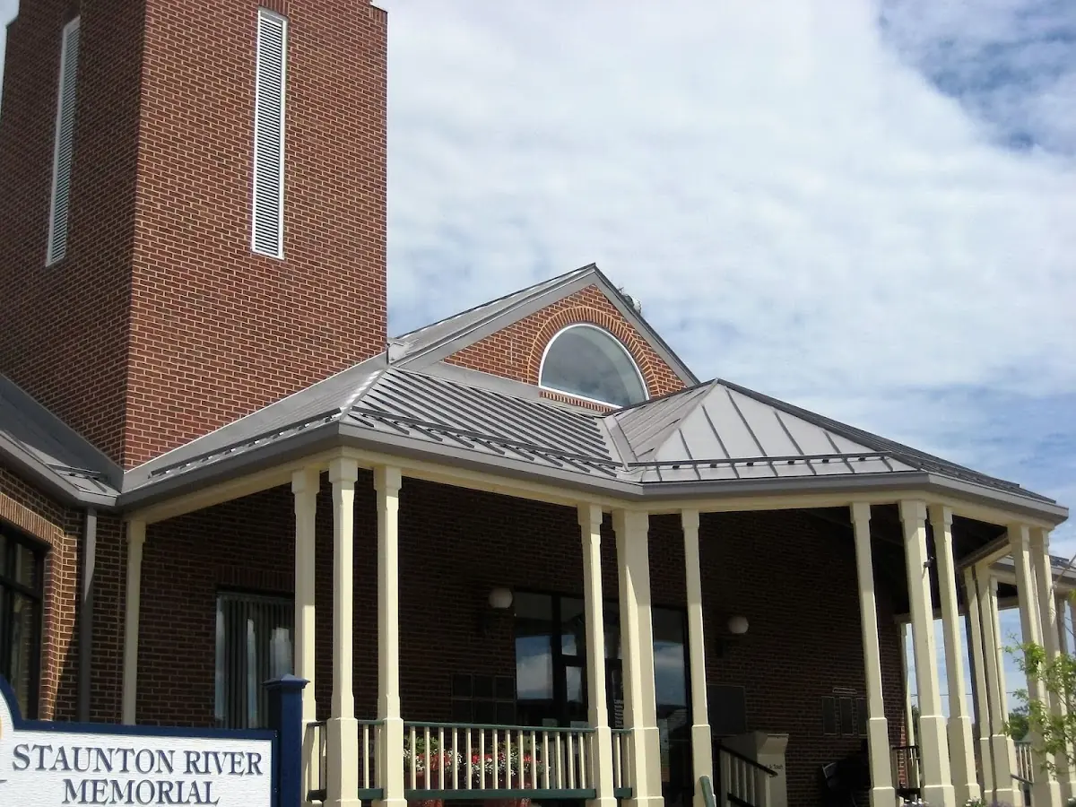 Skilled roofing craftsmen working on a residential roof in Atmore
